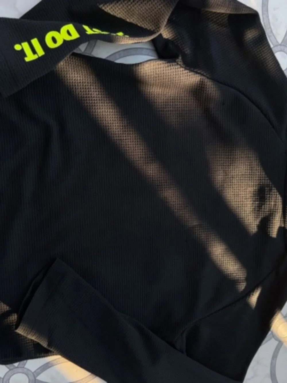 Nike Dri-FIT hoodie featuring a neon yellow swoosh logo and baseball stitching